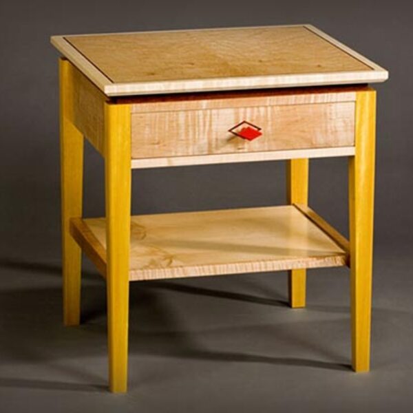 Deco style bedside table with drawer: Curly maple, birdseye maple, pau amarolo, red paint, bubinga inlay. 20″ w x 18″ d x 22″ h
