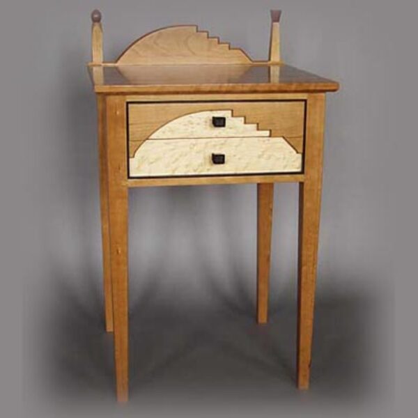 California bedside table: Cherry, bird’s eye maple, rosewood trim and handles. 26″ h x 20″ l x 19″ d