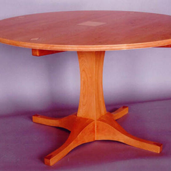 Solid cherry table; It’s got legs! Curly maple and bubinga inlays
52″ diameter 30″ h .