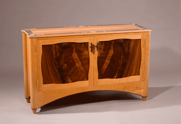 Flower credenza: Crotch mahogany panels, curly cherry qtd., cherry, ebony detail, hand painted border. 52″l x 16.5″d x 30″h